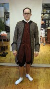 The fabric fitting for Mr. Morgan as a Townsperson, checking pocket placements and fit.