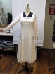 The 20's day dress has a net inner belt that connects hip sashes under the dress front and back